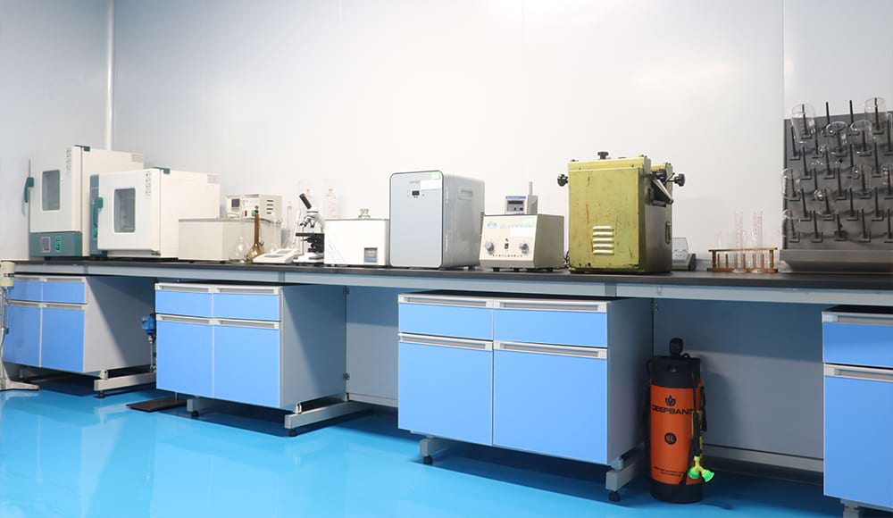 Laboratory Equipment with blue workbenches and safety equipment